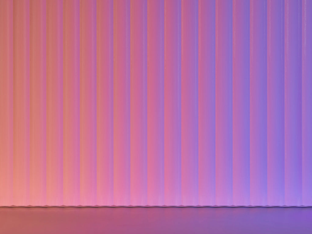 Striped fabric with pink and purple vertical stripes on a gradient background