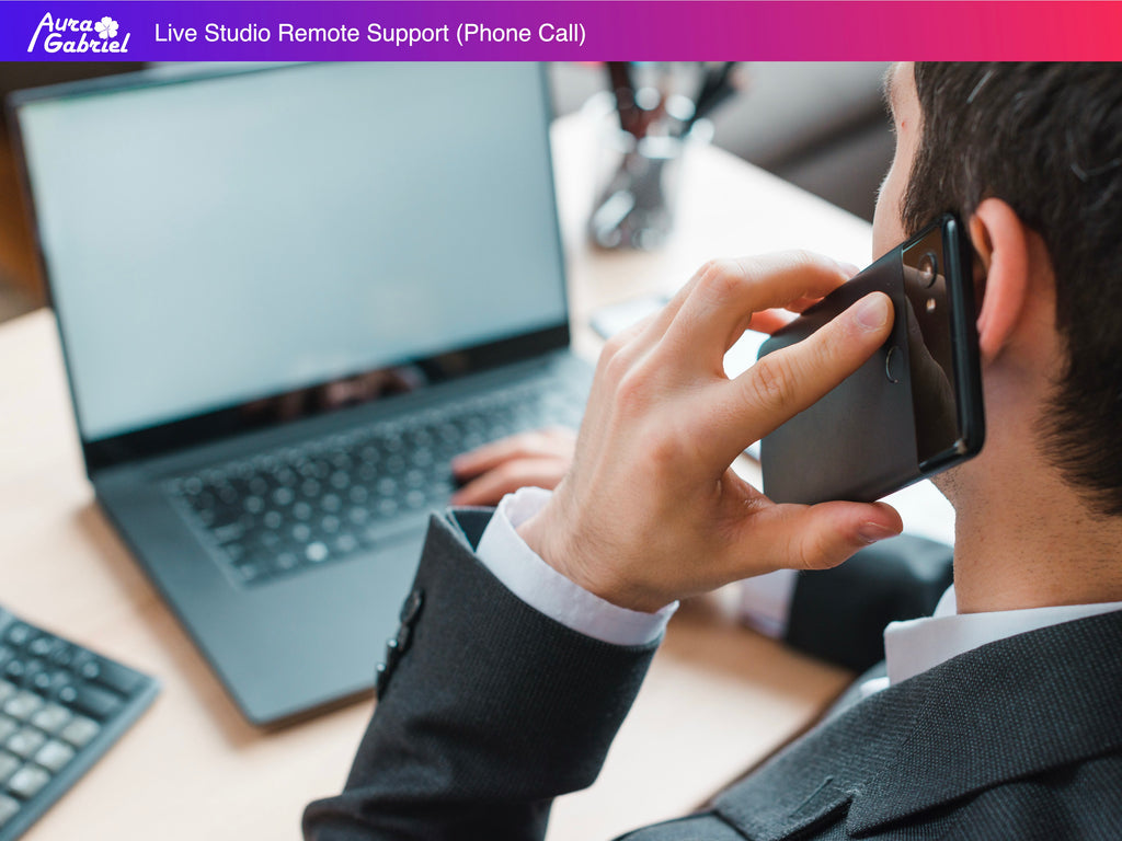 Person on phone call with a laptop and keyboard in the background, with 'Aura Gabriel' branding.